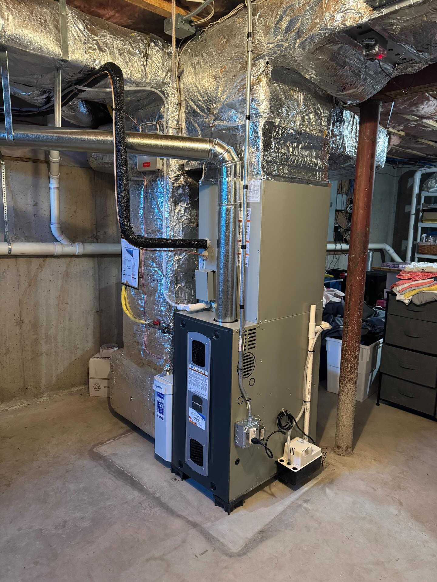 Newly installed high-efficiency modulating gas furnace with PVC venting